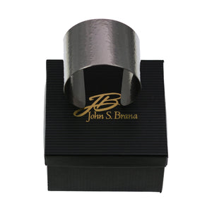 8 of 8: Hammered Stainless Steel Cuff Bracelet on Top of a Black Gift Box