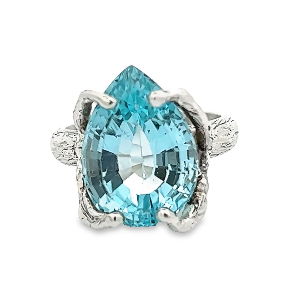 A Pear Shape Swiss Blue Topaz Sterling Silver Cocktail Ring on White Background