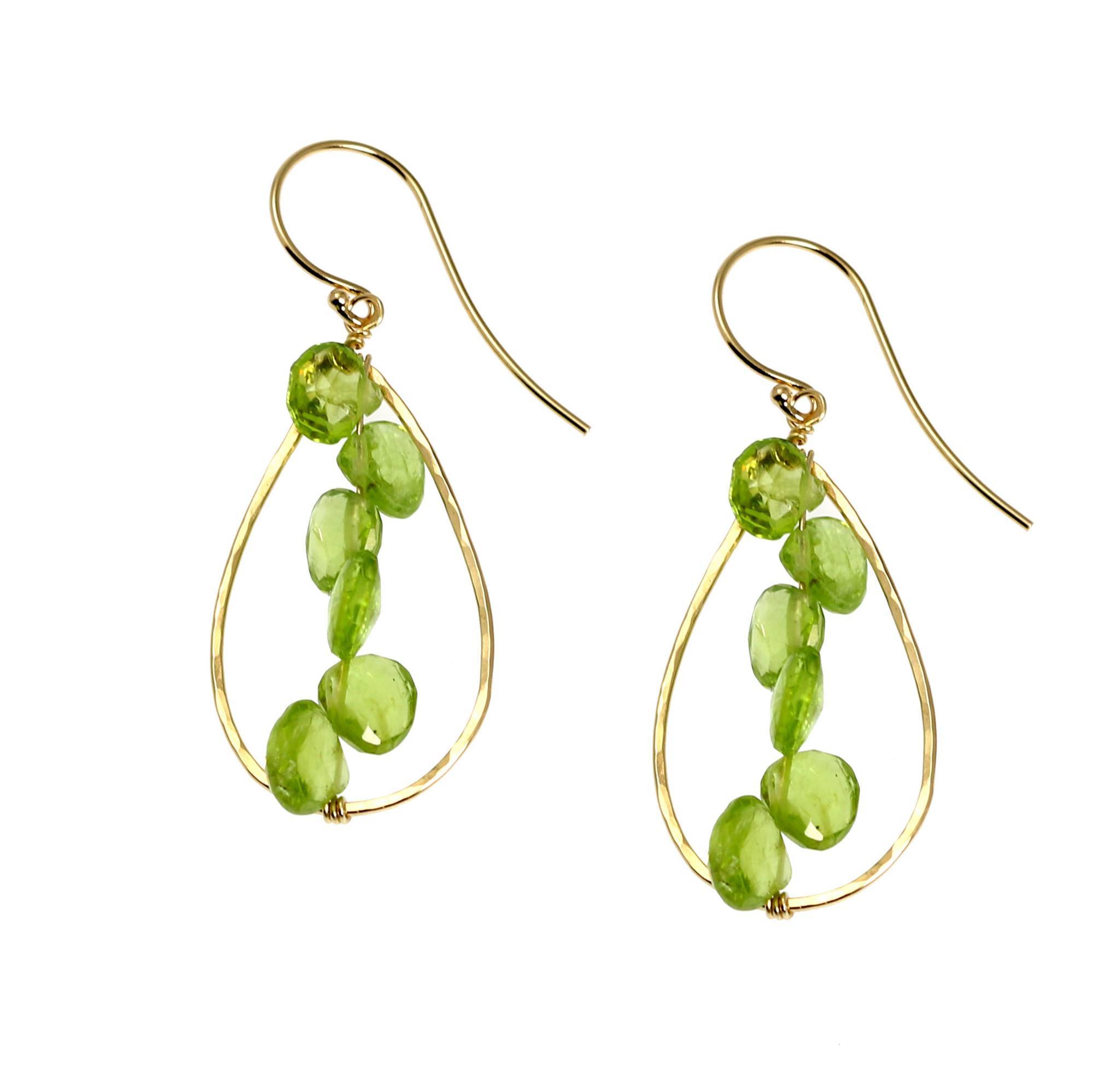1 of 4: A Pair of 14K Gold Hammered Teardrop Earrings With Peridot on a White Background