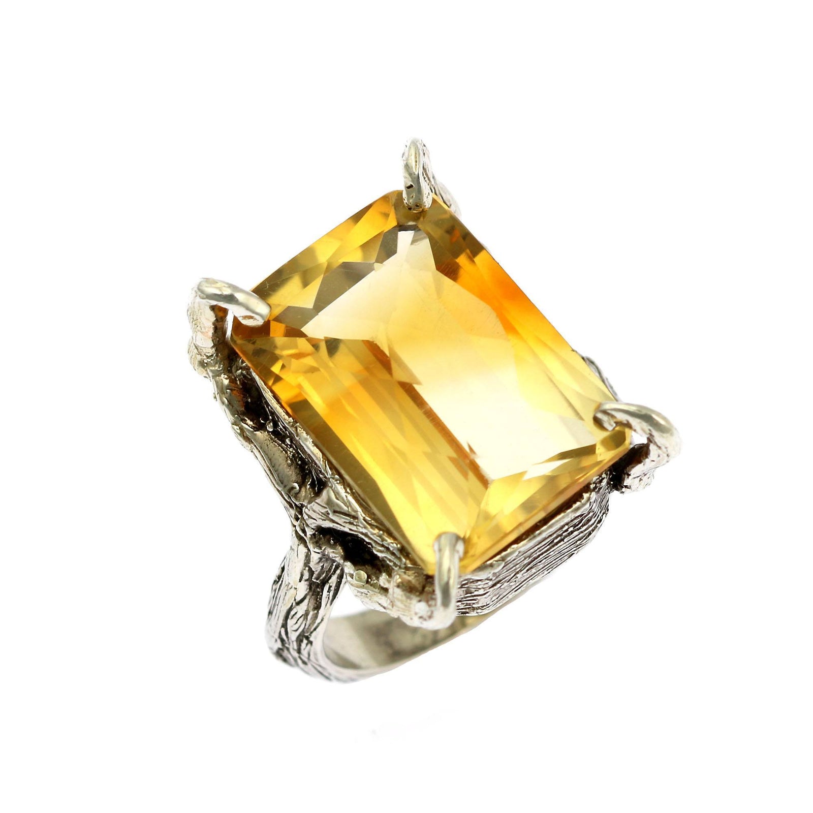 A 21.5 Ct Checkboard Cut Citrine Sterling Silver Cocktail Ring on a White Background