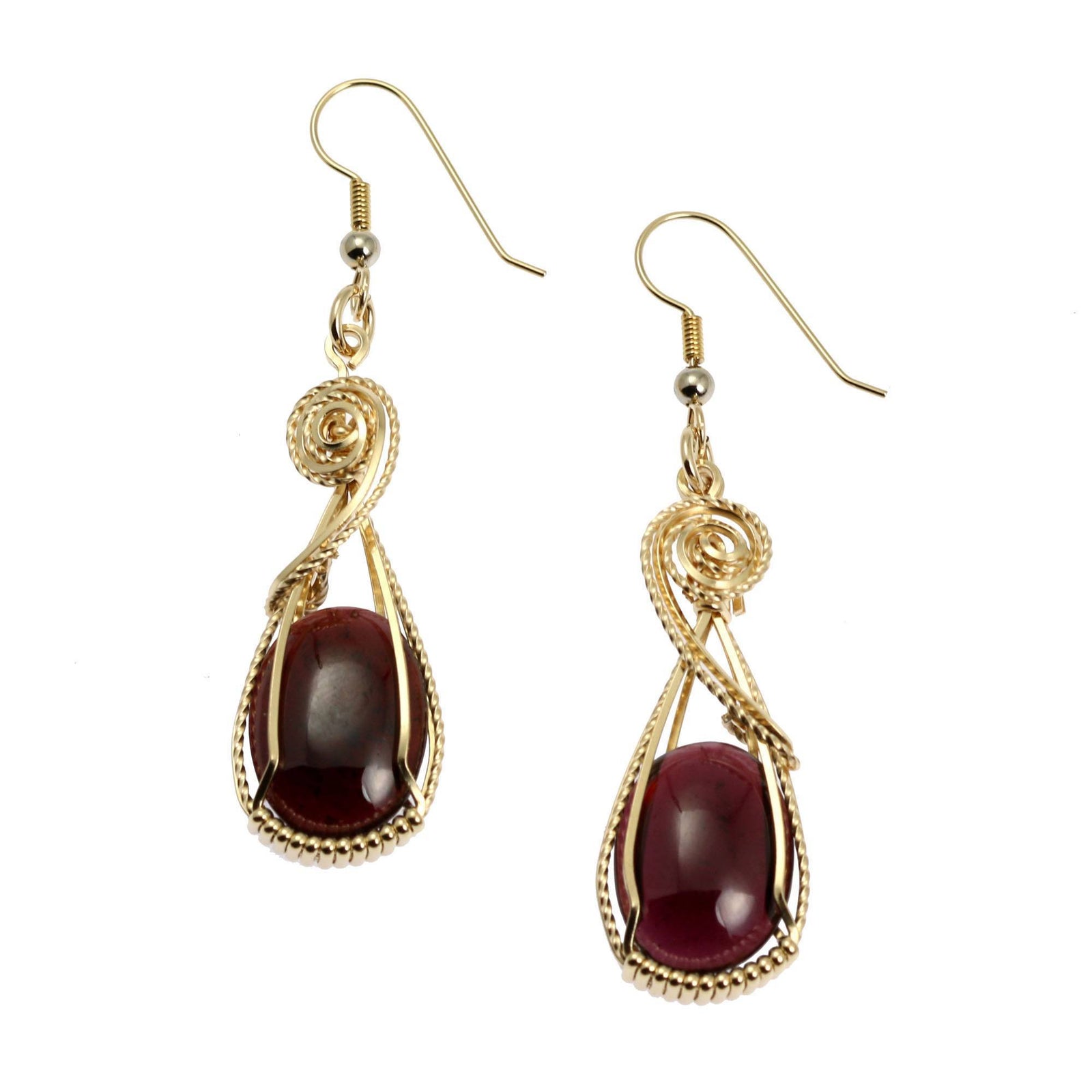A Pair of 23 CT Cabochon Cut Garnet 14K Gold-filled Earrings on a White Background