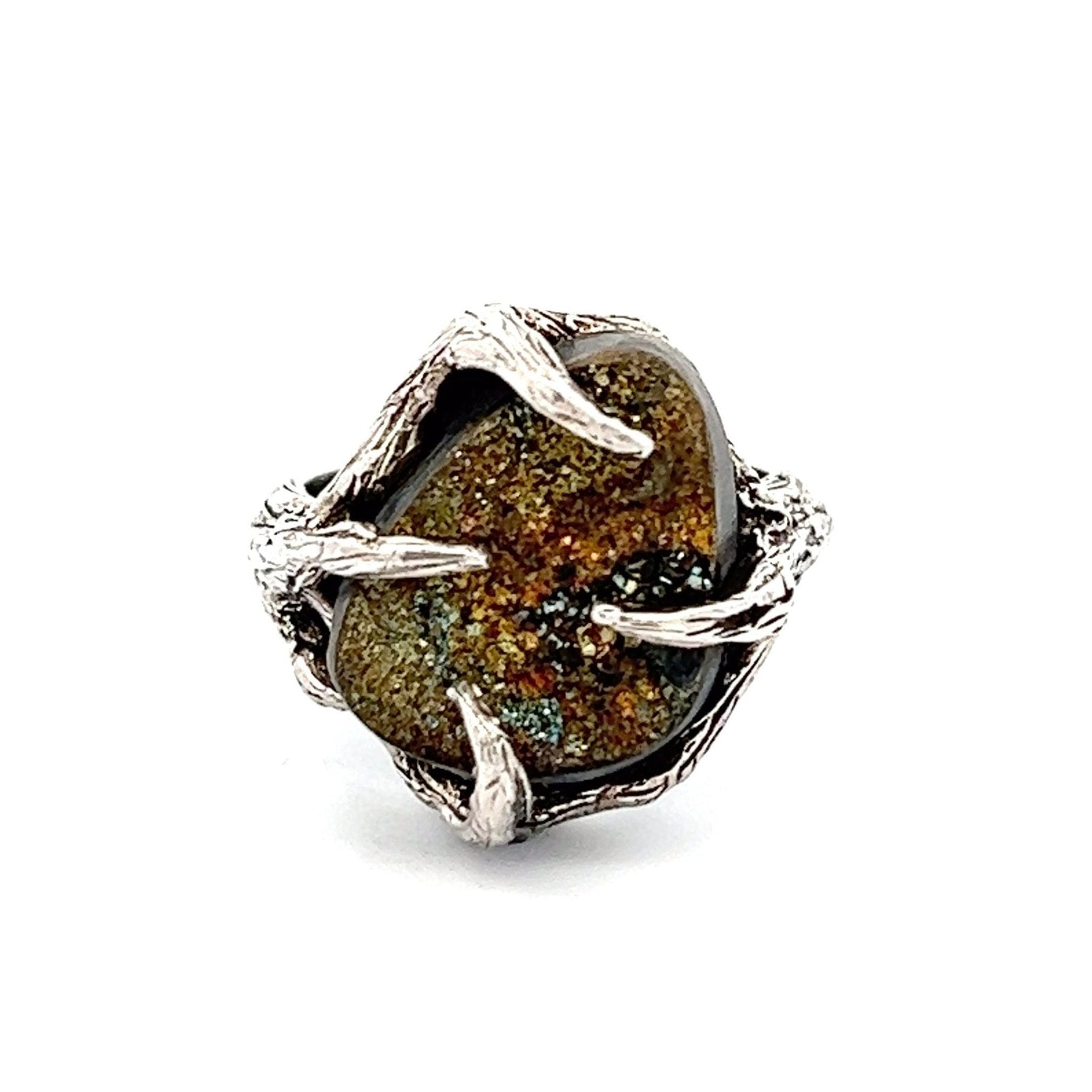 A 9 CT Pyrite Sterling Silver Tree Branch Ring on a White Background