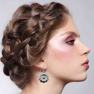 4 of 8: A Stunning Woman Wearing Aluminum Daisy Disc Earrings