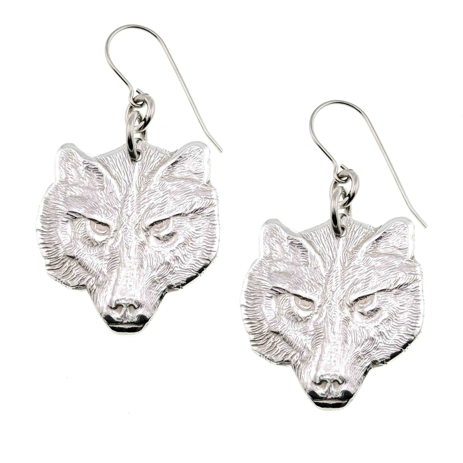 A Pair of Aluminum Wolf Head Earrings on a White Background