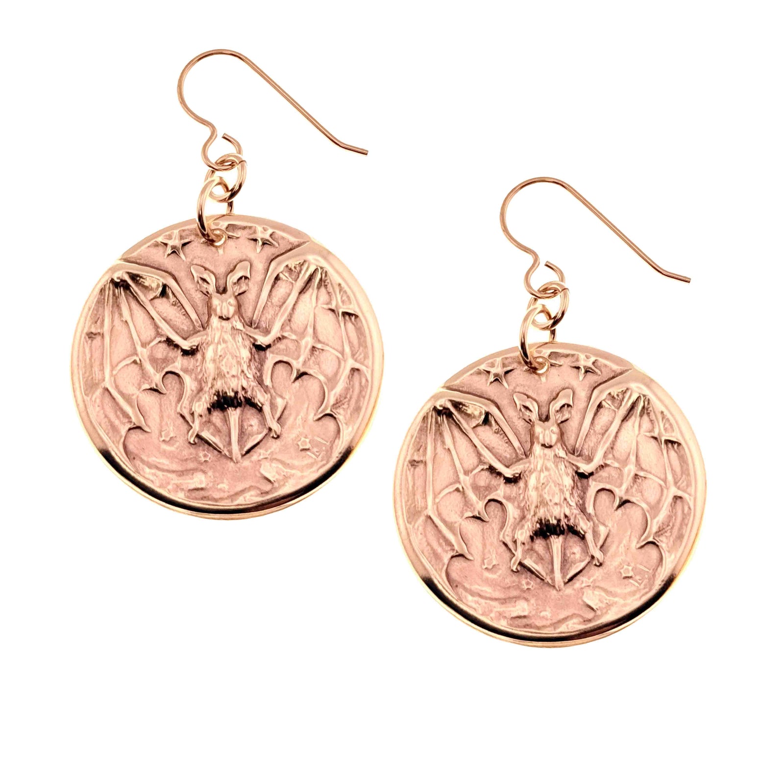 A Pair of Bronze Vampire Bat Disc Dangle Earrings on a White Background