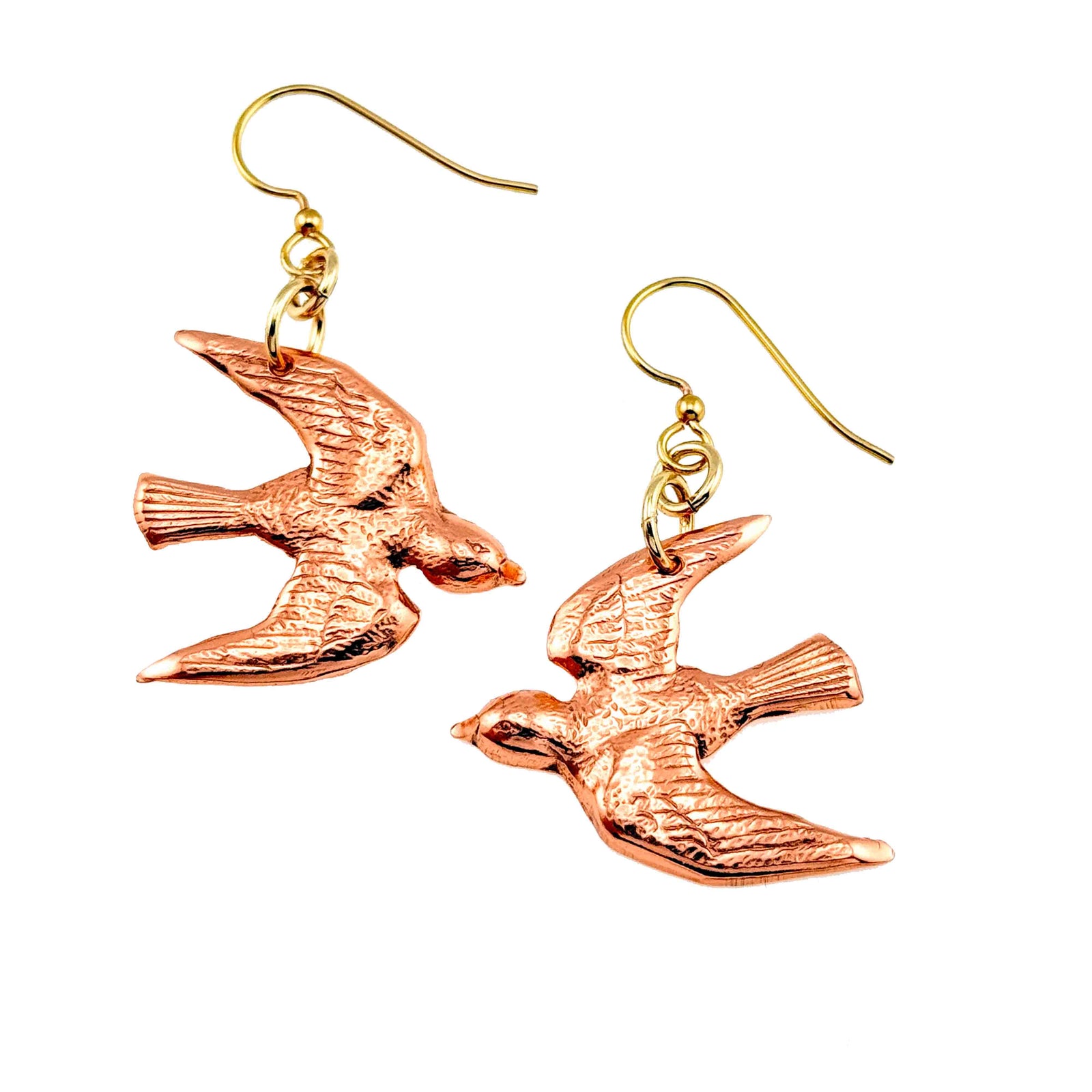 A Pair of Copper Flying Swallow Earrings on a White Background