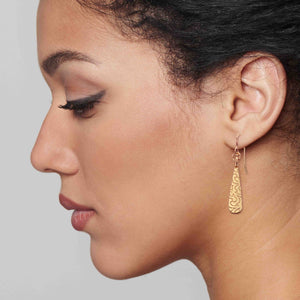 4 of 7: Elegant Woman Wearing Damask Embossed Mini Bronze Teardrop Earrings