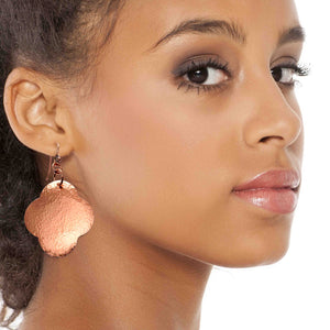 6 of 7: A Chic Woman Wearing Large Hammered Copper Clover Drop Earrings