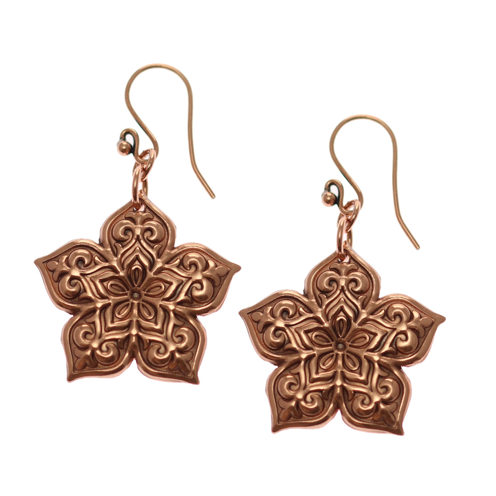 A Pair of Starflower Mandala Copper Drop Earrings on a White Background
