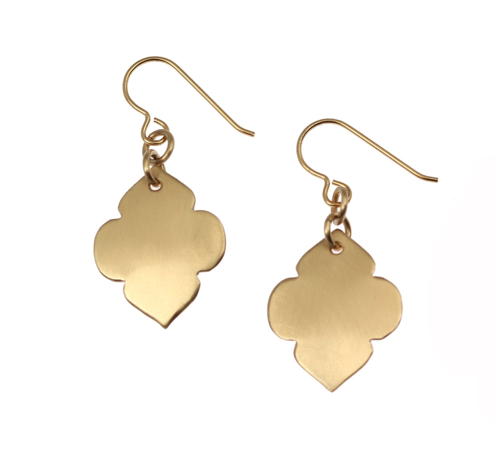 A Pair of Brushed Bronze Quatrefoil Dangle Earrings on a White Background