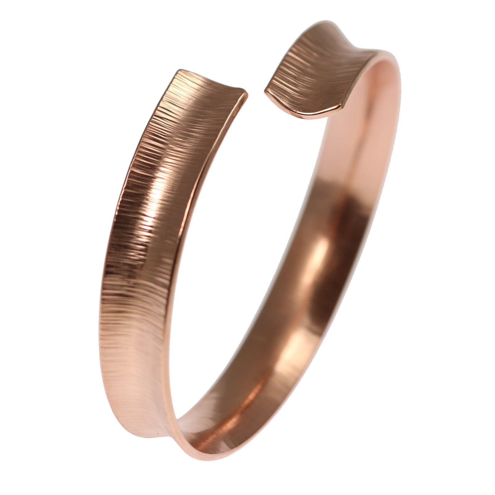 A Chased Copper Bangle Bracelet on a a White Background