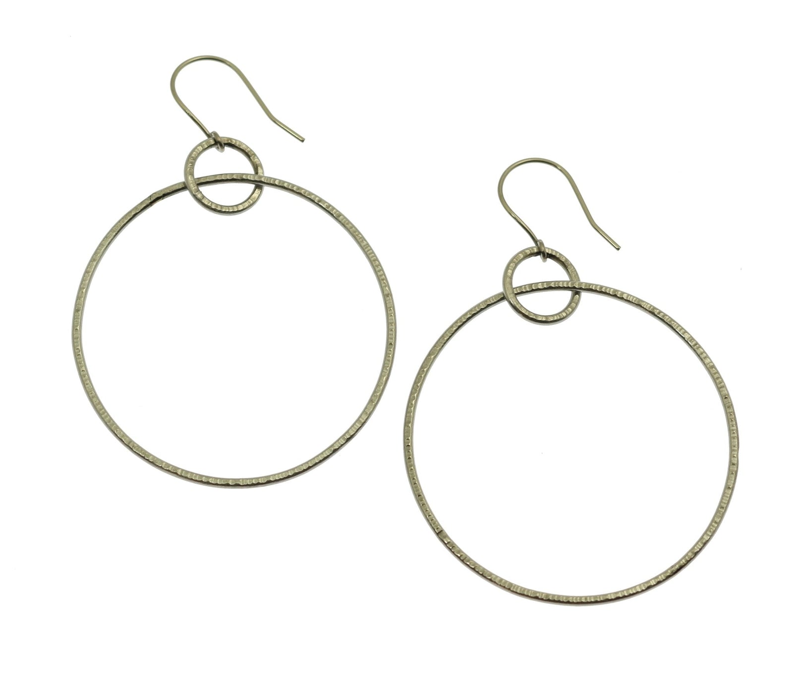 A Pair of Chased Stainless Steel Hoop Earrings on a White Background