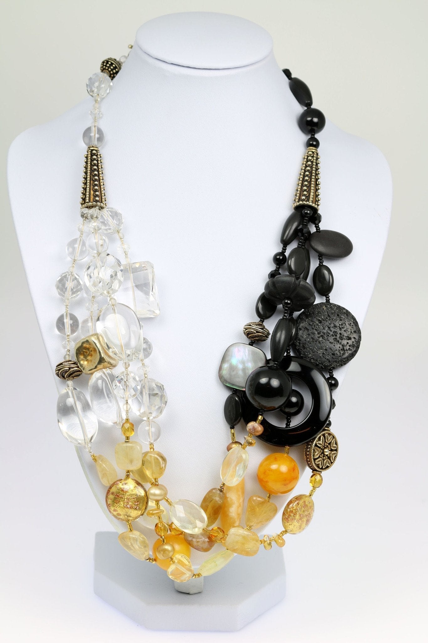 A Crystal Quartz Onyx Amber Beaded Gemstone Necklace on a White Neck Display