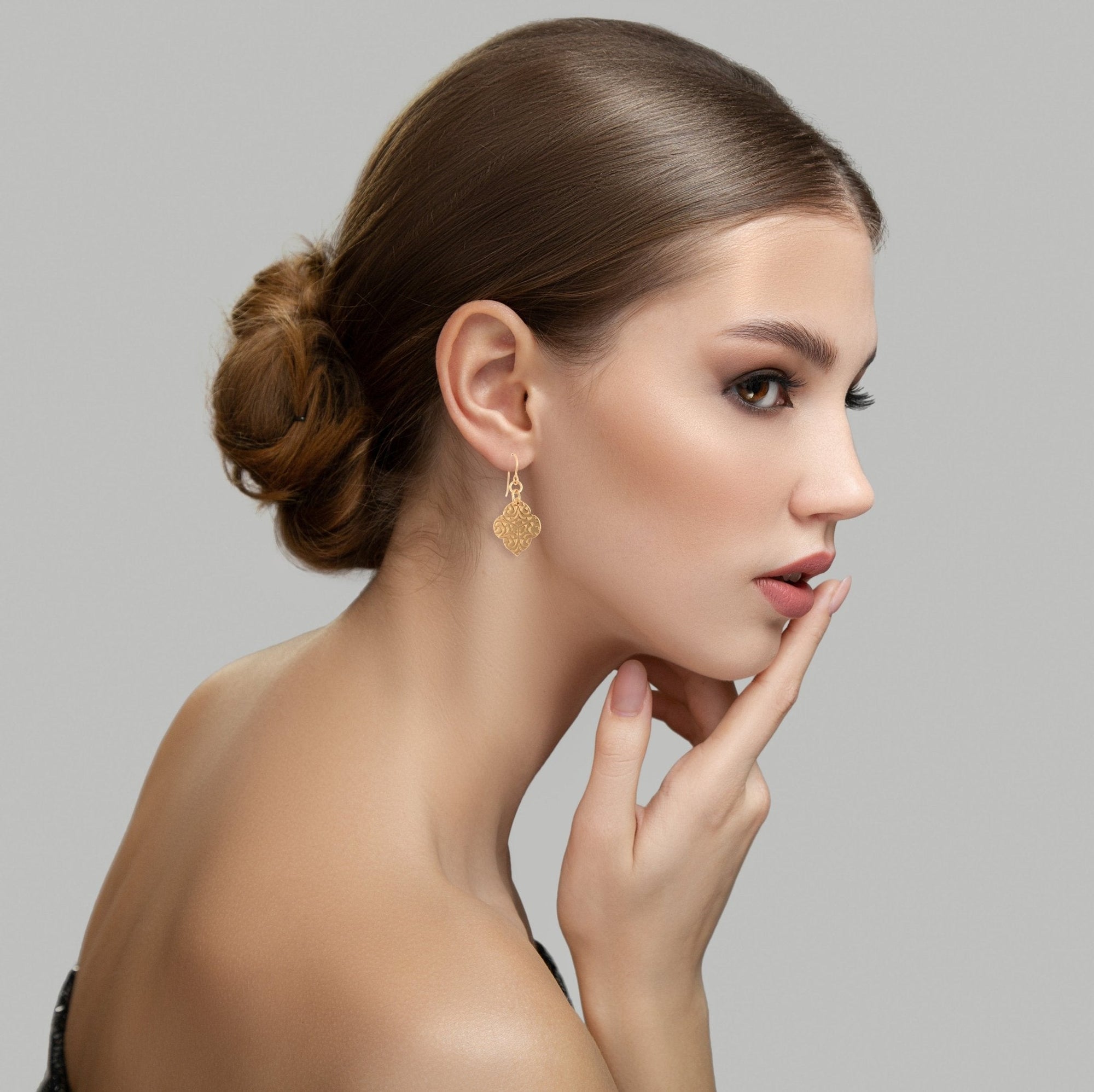 Female Model Wearing Damask Bronze Quatrefoil Drop Earrings