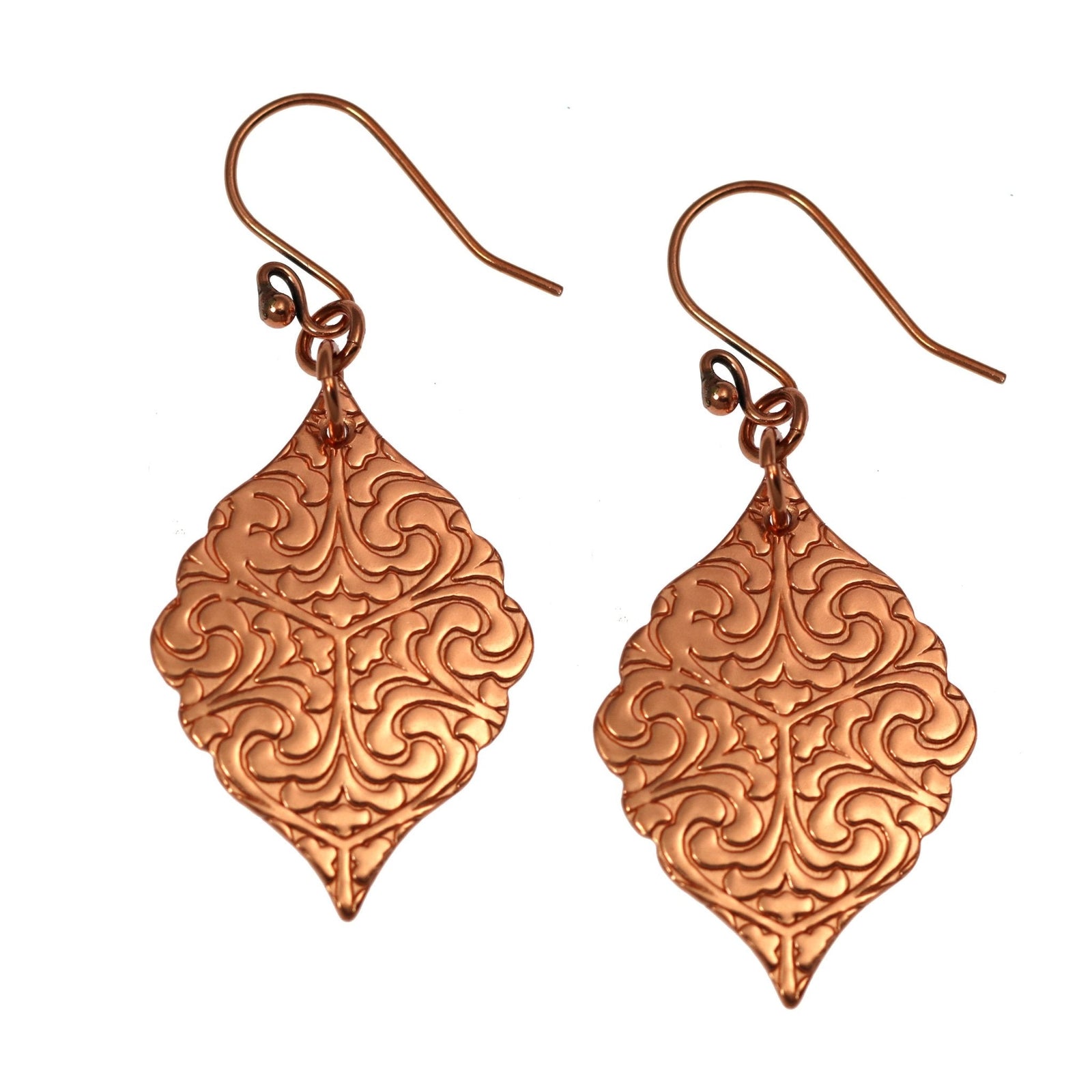 A Pair of Damask Embossed Copper Moroccan Drop Earrings on a White Background
