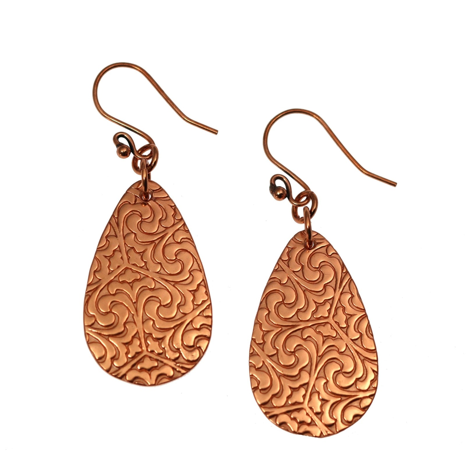 A Pair of Damask Embossed Copper Teardrop Earrings on a White Background