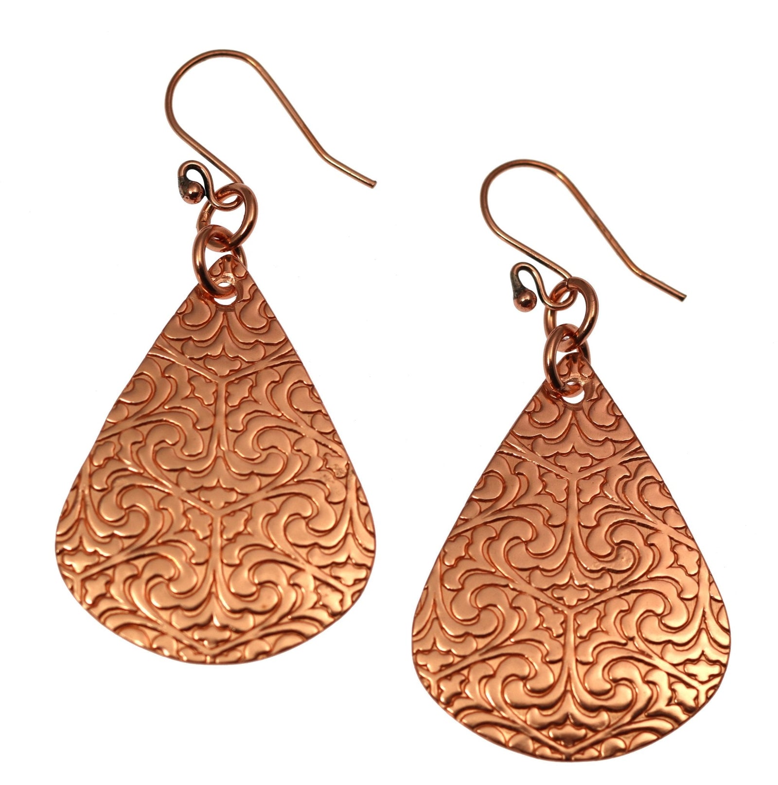A Pair of Damask Embossed Copper Teardrop Earrings on a White Background