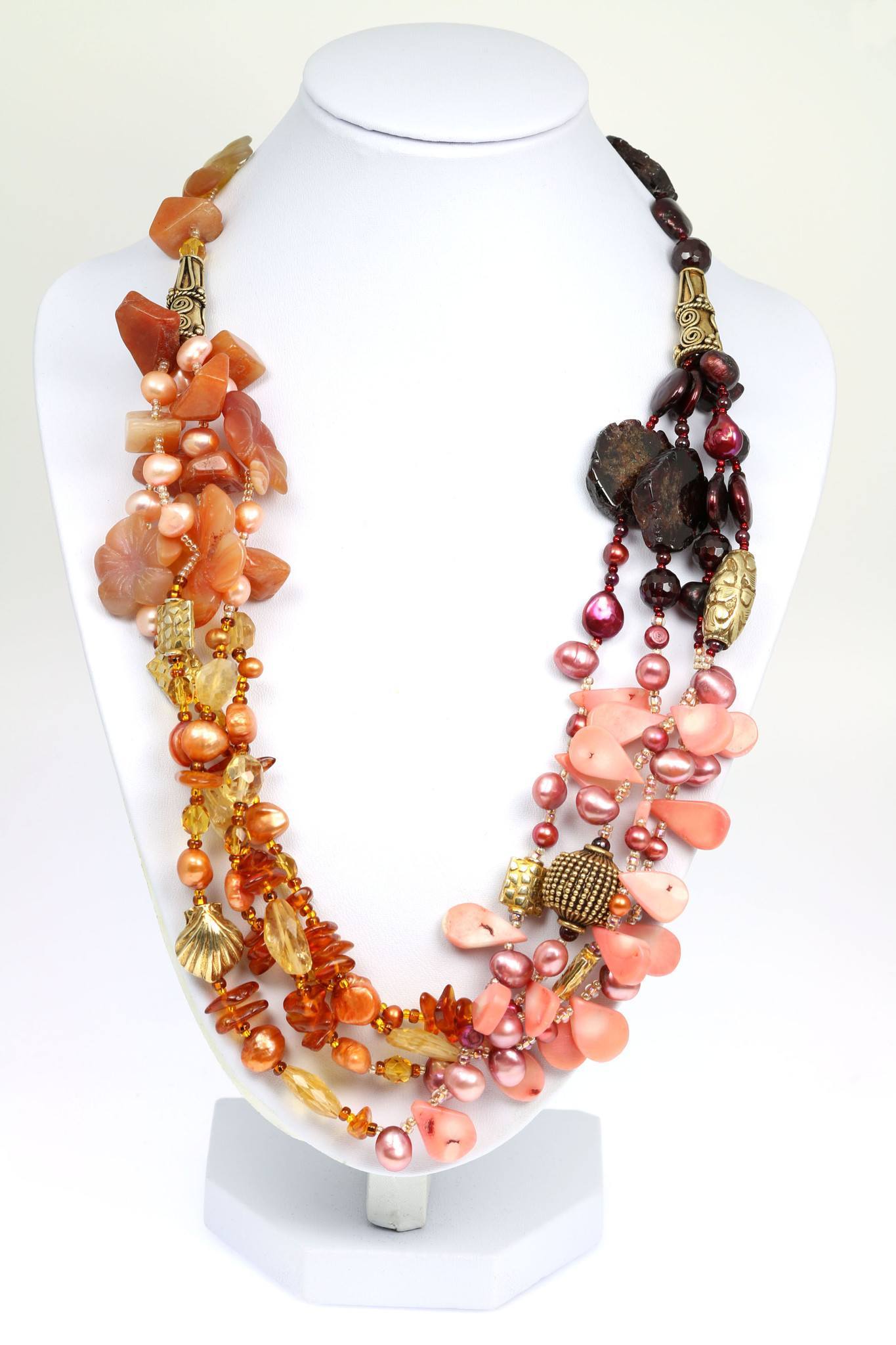 A Garnet Amber Carnelian Beaded Gemstone Necklace on a White Neck Display