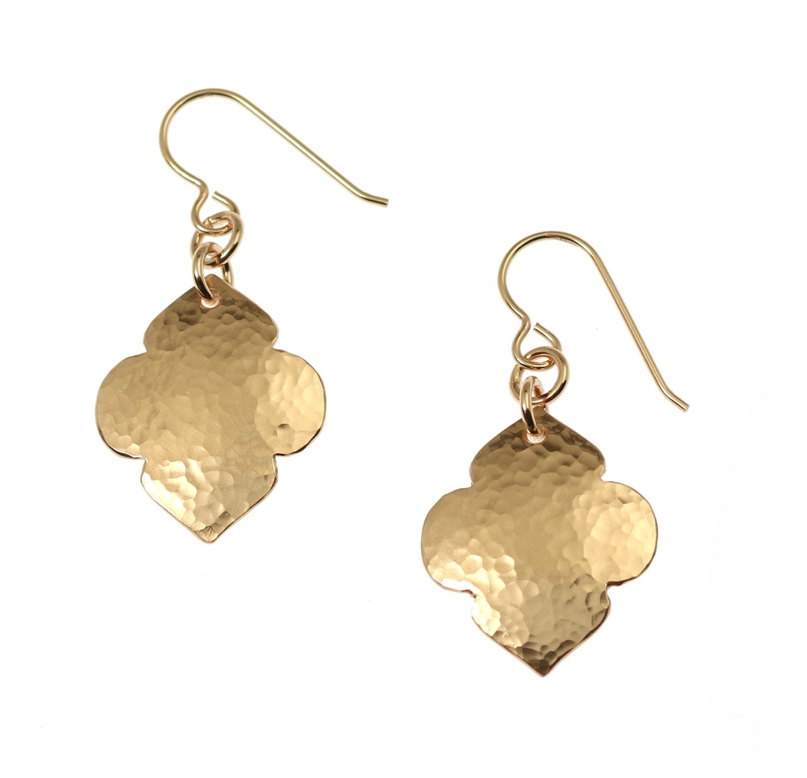 A Pair of Hammered Bronze Quatrefoil Drop Earrings on a White Background