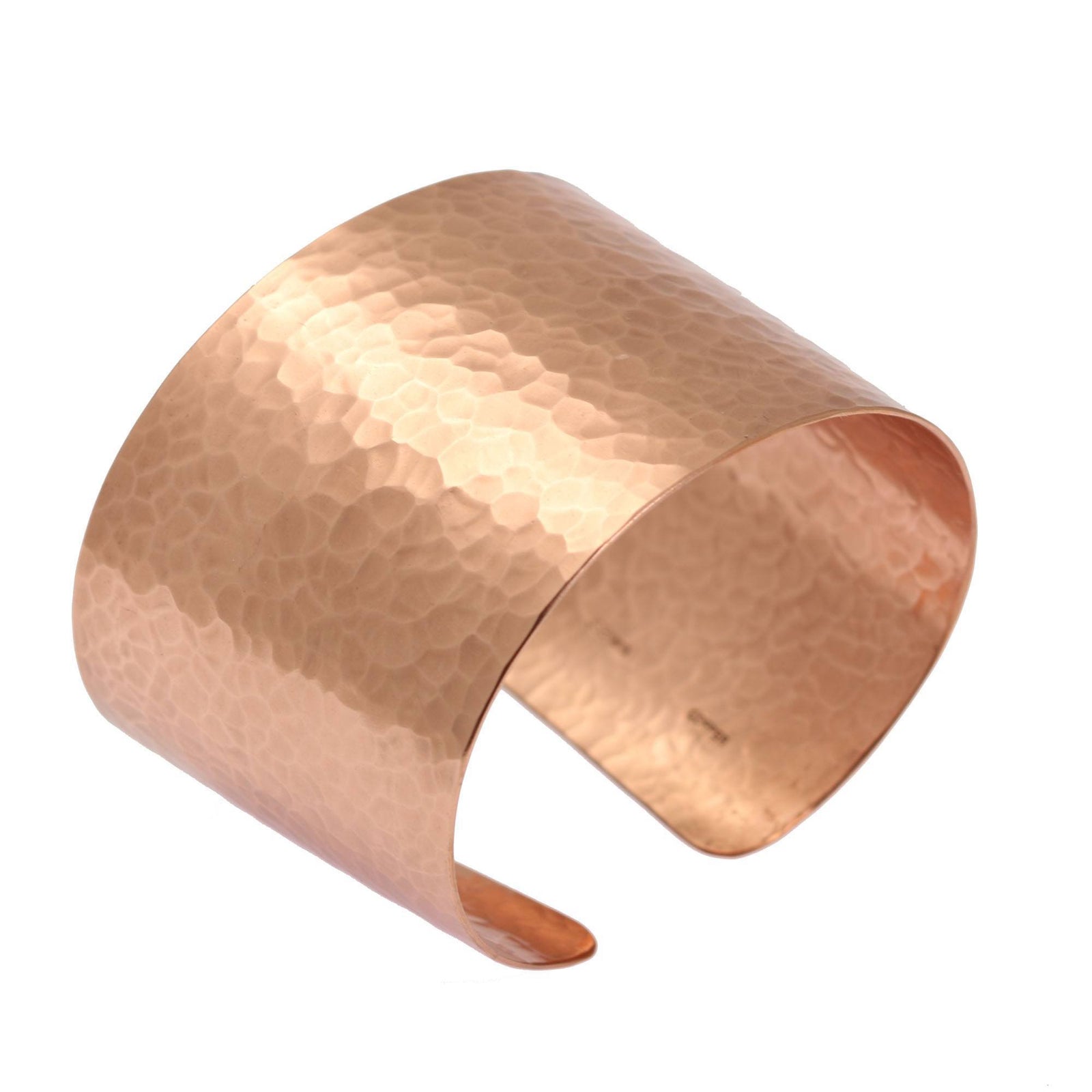 A Hammered Copper Cuff Bracelet on a White Background