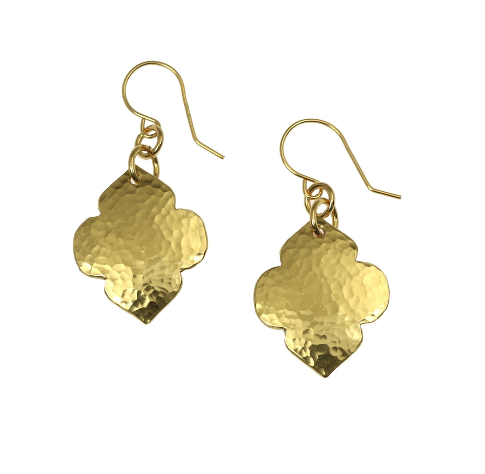 A Pair of Hammered Nu Gold Quatrefoil Dangle Earrings on a White Background