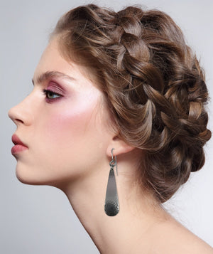 2 of 5: Woman Wearing Hammered Stainless Steel Teardrop Earrings