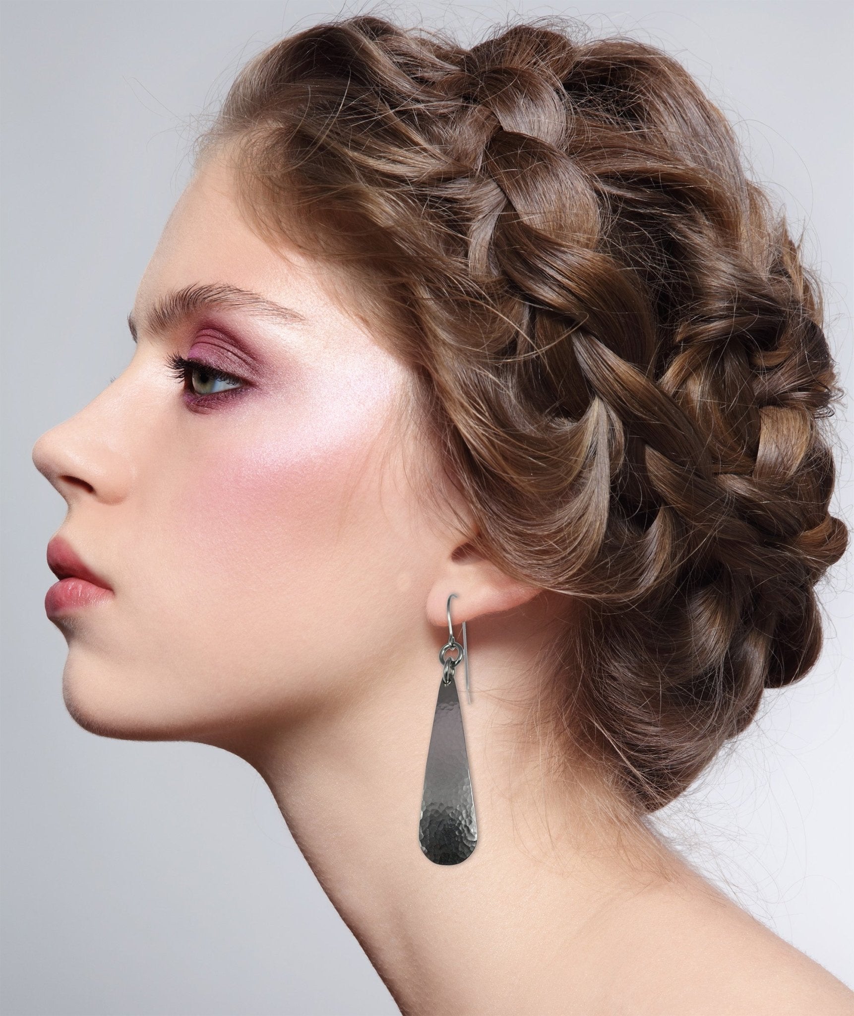 2 of 5: Woman Wearing Hammered Stainless Steel Teardrop Earrings