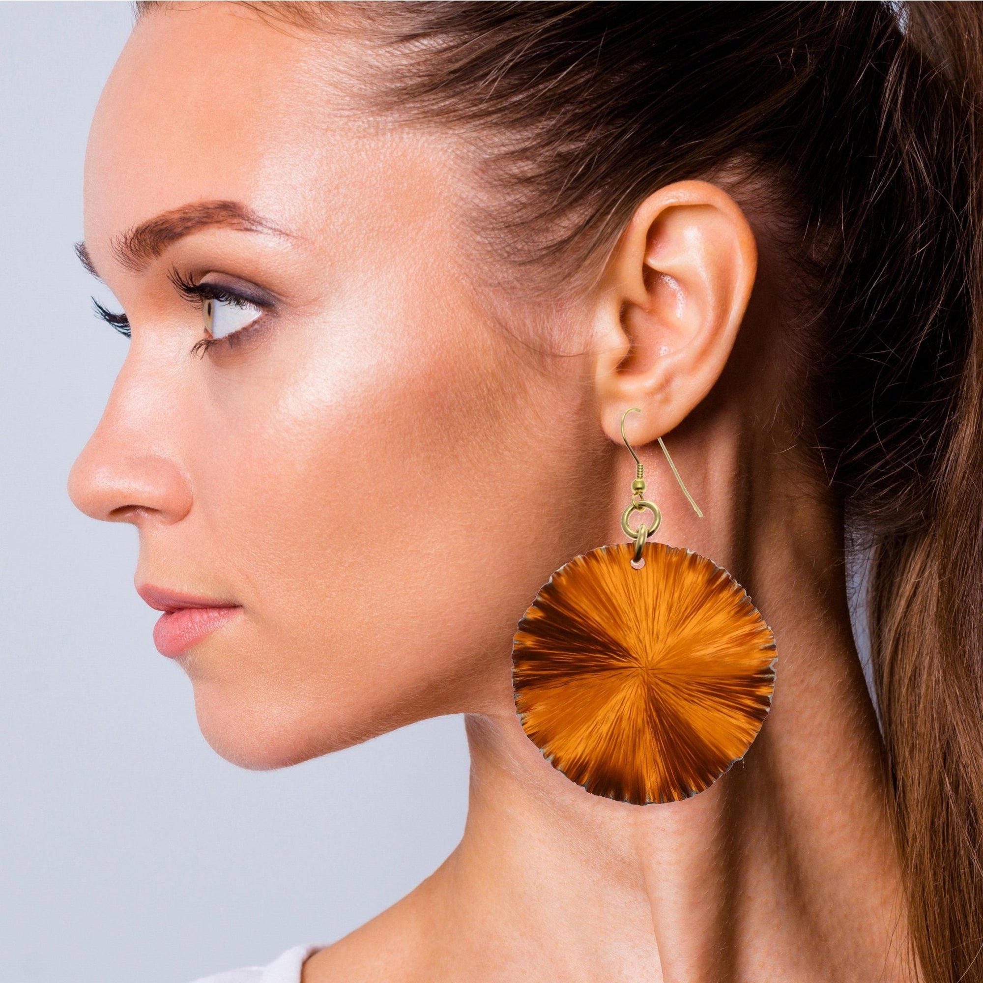 Orange Anodized Aluminum Lily Pad Earrings on Female Model