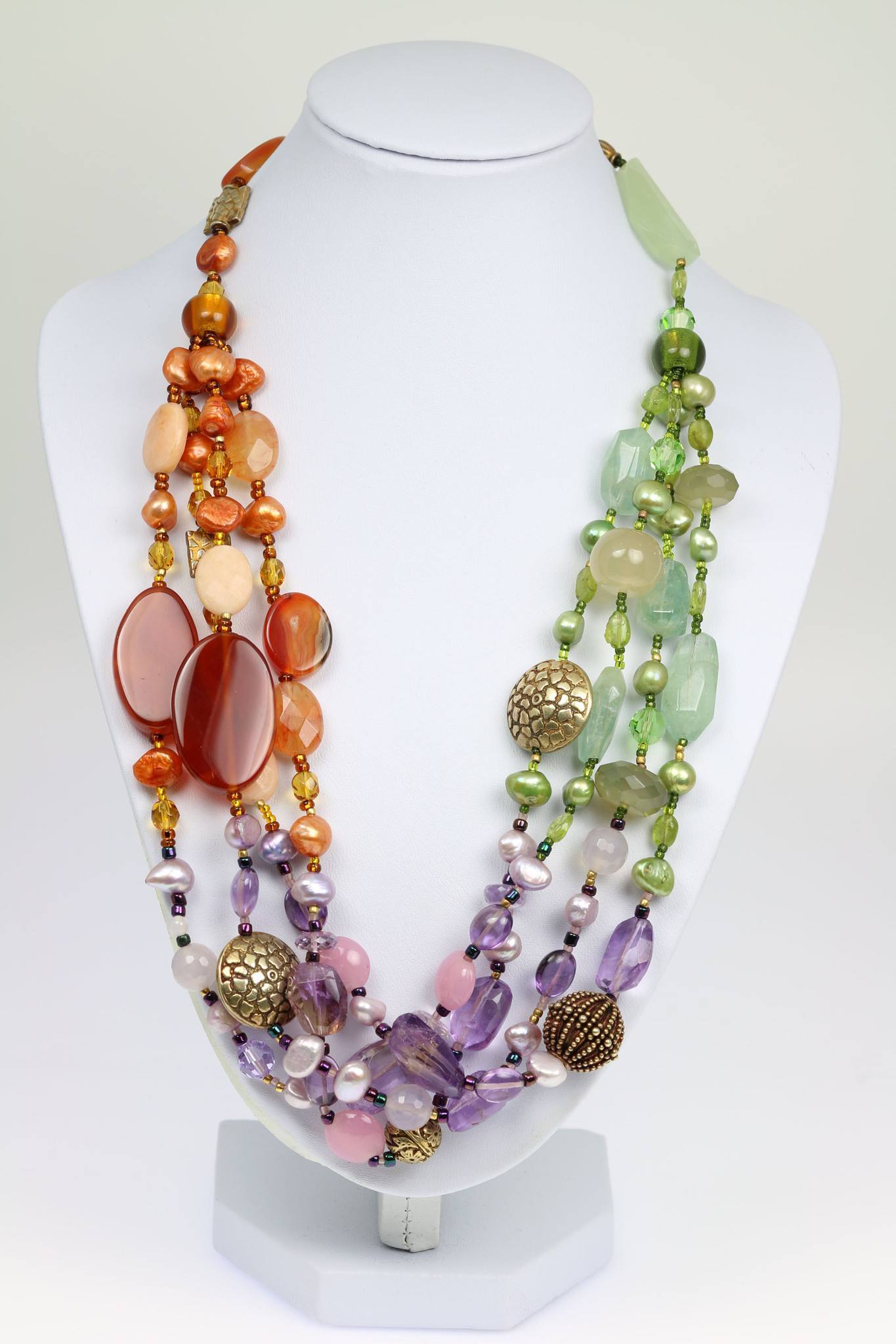 A Prehnite Amethyst Carnelian Necklace on a White Neck Display