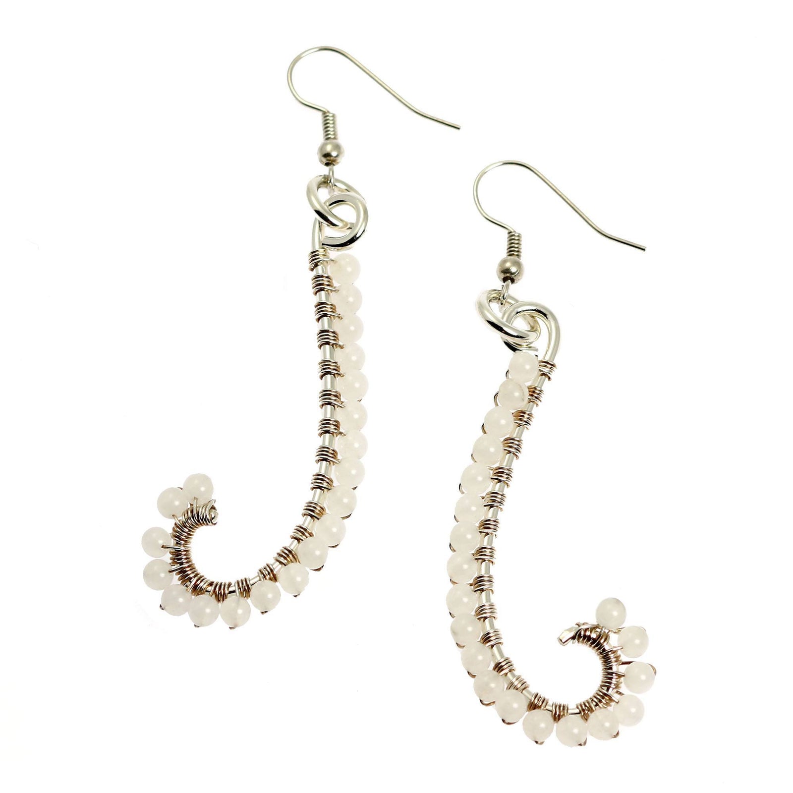 A Pair of Snow Quartz Wire Wrapped Silver Earrings on a White Background