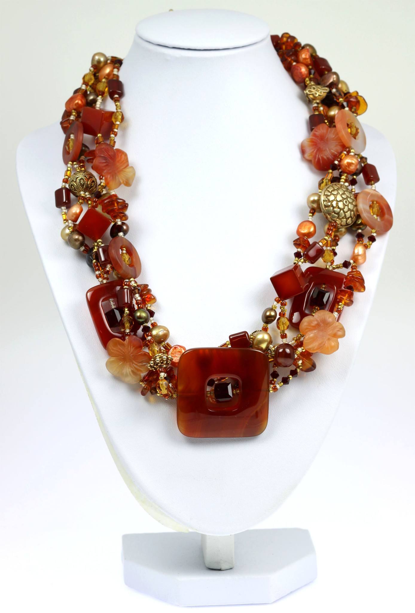 A Square Carnelian Beaded Gemstone Necklace on a White Neck Display