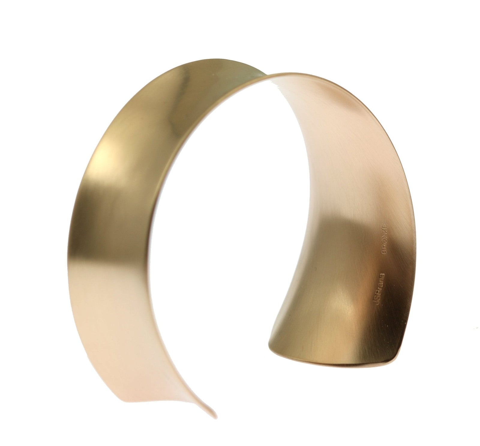 A Tapered Brushed Bronze Anticlastic Cuff on a White Background
