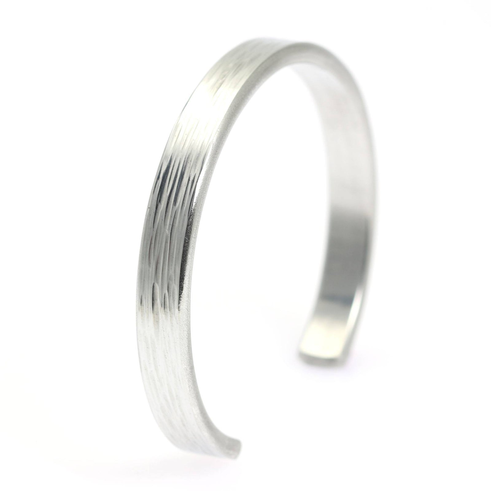 A Thin Bark Aluminum Cuff Bracelet on a White Background