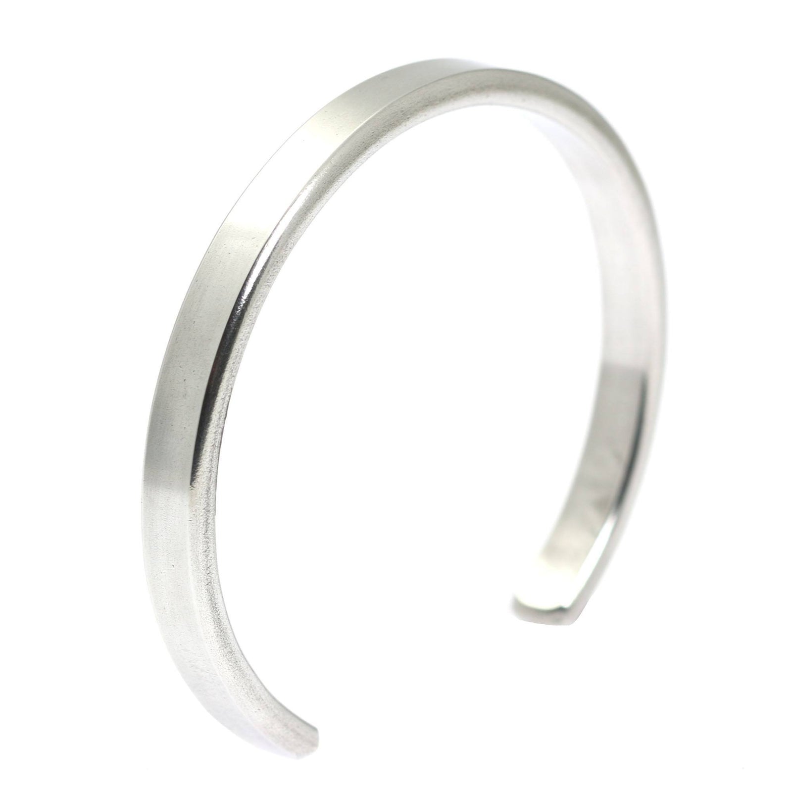 A Thin Brushed Aluminum Cuff Bracelet on a White Background