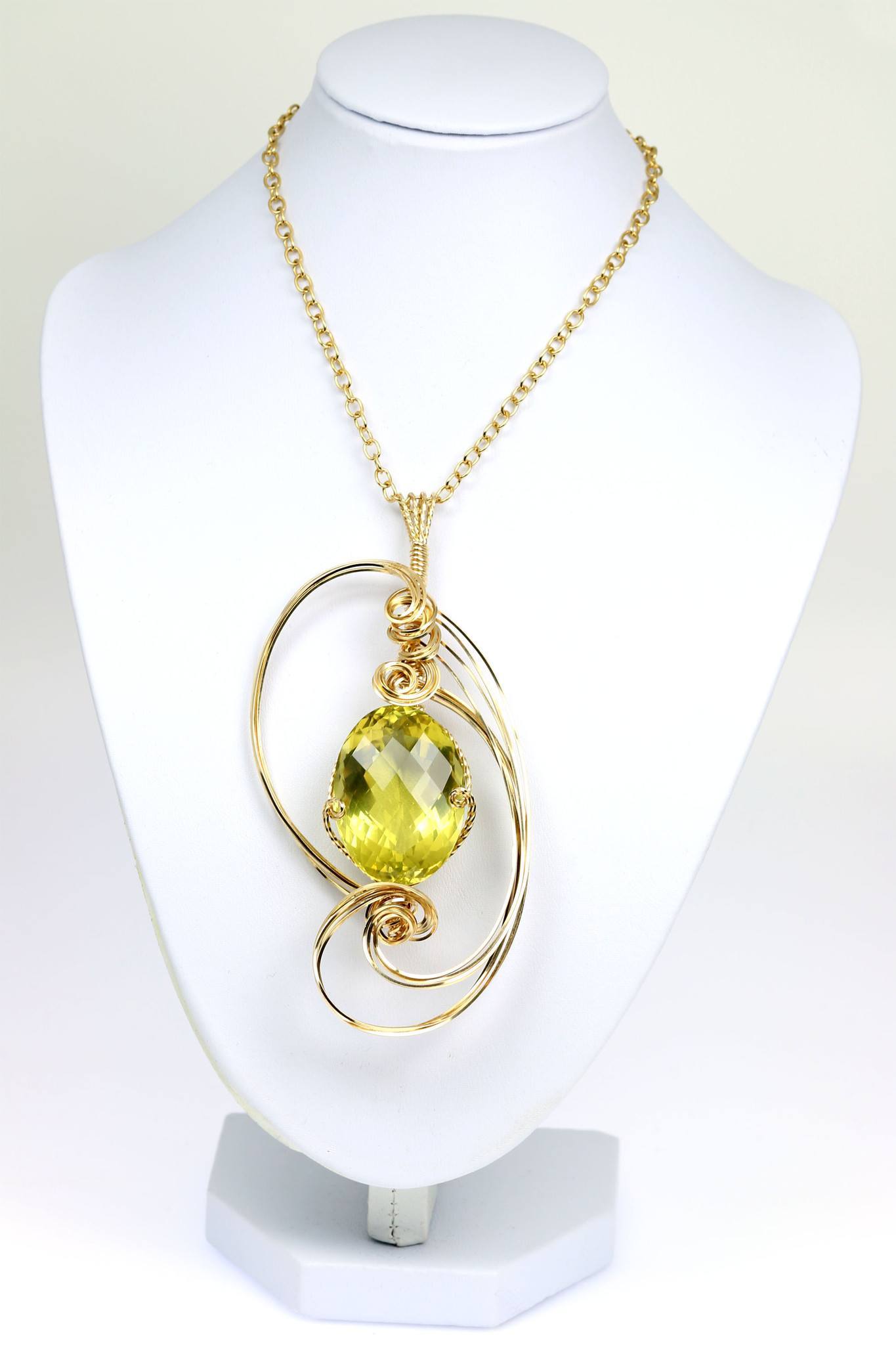 102.5 CT Green Gold Quartz 14K Gold-filled Pendant on Chain Hanging on a Display Neck