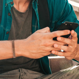 4 of 9: Man in Brown and Green Shirt Wearing Men's 10 MM Wide Embossed Snakeskin Solid Copper Cuff 