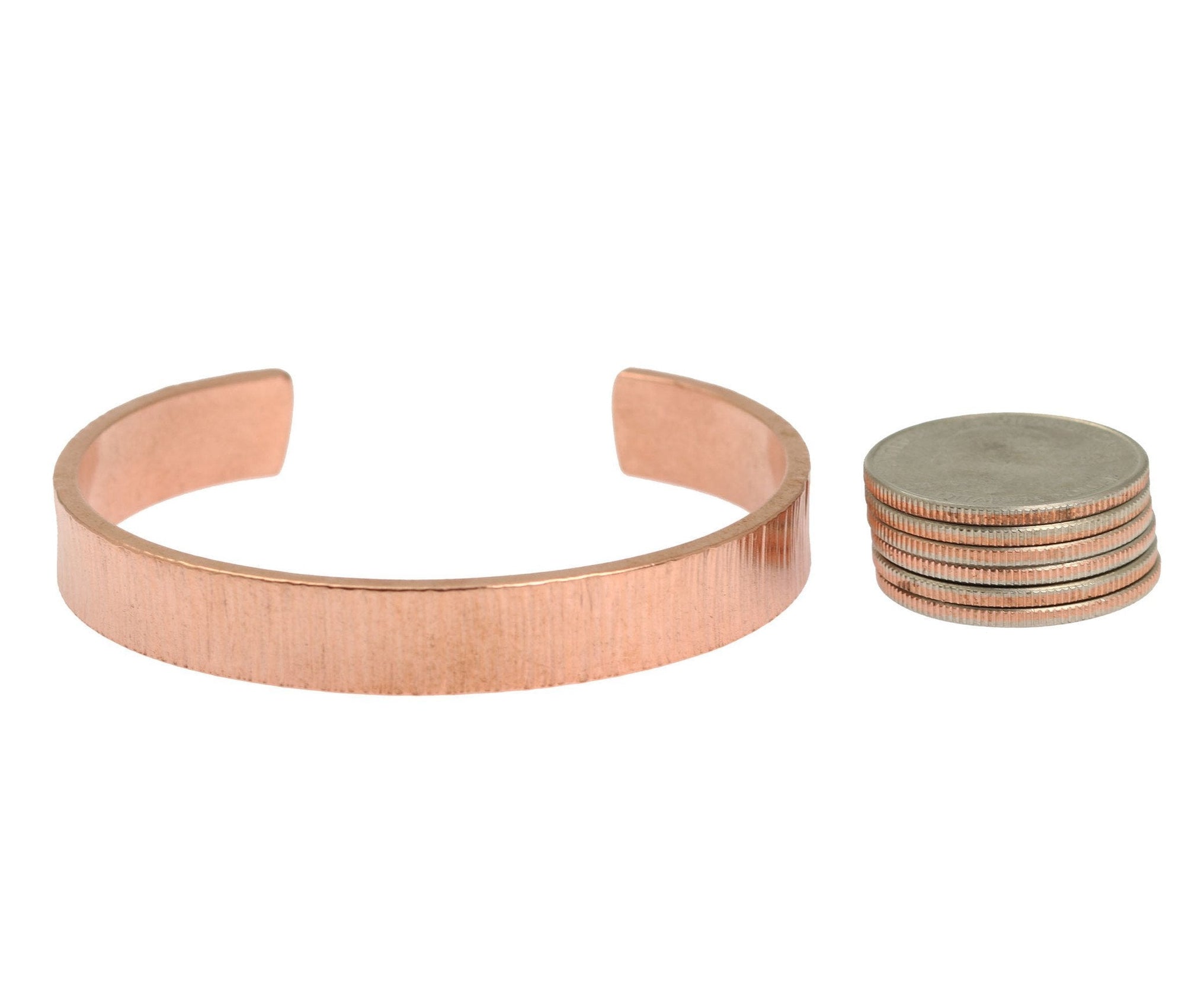 Width of 10mm Wide Chased Copper Cuff Bracelet compared with 6 stacked US Quarters