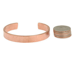 5 of 7: Width of 10mm Wide Chased Copper Cuff Bracelet compared with 6 stacked US Quarters