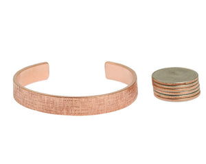 6 of 6: Width of 10mm Wide Linen Copper Cuff Bracelet by John Brana compared to 6 stacked US Quarters