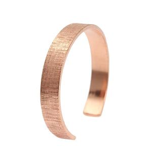 1 of 6: A 10mm Wide Linen Copper Cuff Bracelet on a White Background