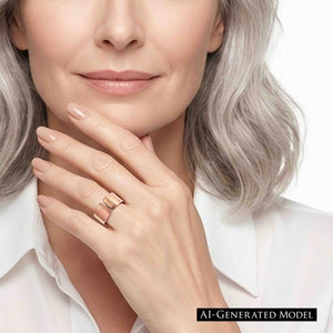 4 of 9: Woman with silver gray hair wearing a polished copper bark texture open cuff ring, styled with a white blouse and neutral manicure for a clean, elegant everyday jewelry look.  AI Generated Model.