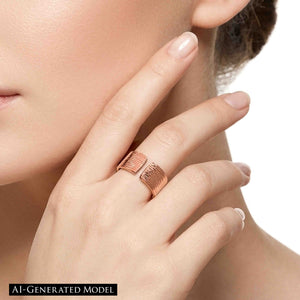 6 of 9: Woman wearing a polished copper bark texture open cuff ring on her finger, with warm rose copper shine, squared ends, and a clean close up beauty styling against bare skin.  AI Generated Model.