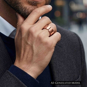 2 of 8: Close up lifestyle image of a man wearing a wide copper cuff ring on his ring finger while resting his hand against his chin. The ring has an open back and a hand chased texture with polished copper shine. He is dressed in a dark blazer, navy sweater, and white collared shirt, giving the handmade copper ring a modern, masculine, business casual look.  AI Generated Model.
