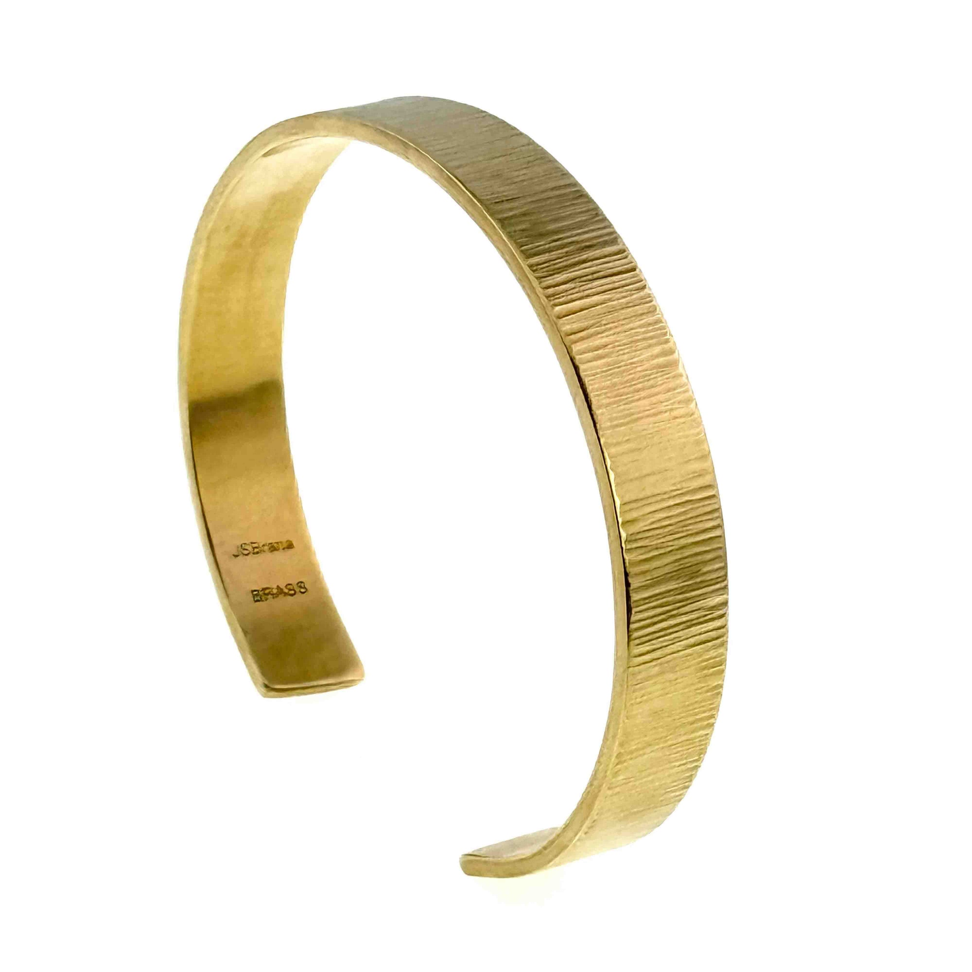 10mm Wide Chased Nu Gold Tone Brass Cuff Bracelet on a white background