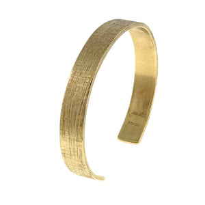 3 of 9: 10mm Wide Linen Nu Gold Tone Brass Cuff Bracelet on a white background - Left Side View