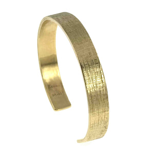 1 of 9: 10mm Wide Linen Nu Gold Tone Brass Cuff Bracelet on a white background