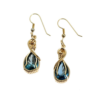 1 of 4: A Pair of 12 CT London Blue Topaz 14K Gold-filled Earrings on a White Background