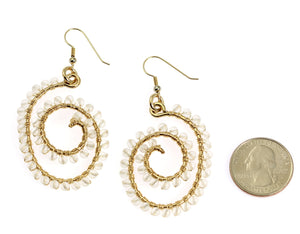 2 of 3: Wire Wrapped Spiral Earrings With Crystal Quartz Gemstones compared to a US Quarter Coin for Size Dimensions