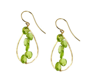 1 of 4: A Pair of 14K Gold Hammered Teardrop Earrings With Peridot on a White Background