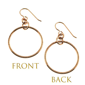 3 of 8: Front and back views of handmade 1 inch chased bronze hoop earrings on a white background. Each earring has a round bronze hoop with hand chased texture, glossy polished finish, connecting rings, and bronze French ear wire. Gold text below identifies the front and back views.